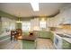 Spacious kitchen featuring custom cabinetry and a charming breakfast nook at 12435 Mallard Dr, Charlotte, NC 28269