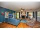 Cozy living room features a brick fireplace, hardwood floors, and lots of natural light at 12435 Mallard Dr, Charlotte, NC 28269