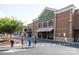 Exterior view of the Publix grocery store with people walking across the crosswalk at 12435 Mallard Dr, Charlotte, NC 28269