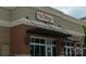 Exterior of a modern Japanese restaurant with brick facade and sleek black awning at 12435 Mallard Dr, Charlotte, NC 28269