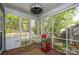 Relaxing screened porch with outdoor grill and views of wooded backyard at 12435 Mallard Dr, Charlotte, NC 28269