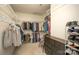 Spacious walk-in closet with ample shelving and hanging space, and a small chest of drawers for organized storage at 12435 Mallard Dr, Charlotte, NC 28269
