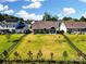 Aerial view of the home highlighting its generous backyard, patio, and well-maintained landscaping at 12512 Journeys End Trl, Huntersville, NC 28078