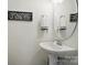 Bathroom with stylish sink, framed quote decor, and modern fixtures at 12512 Journeys End Trl, Huntersville, NC 28078