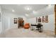 Versatile bonus room or office space with sloped ceilings and carpet at 12512 Journeys End Trl, Huntersville, NC 28078