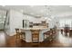 Bright kitchen with white cabinets, granite countertops, stainless steel appliances, and breakfast bar seating at 12512 Journeys End Trl, Huntersville, NC 28078