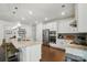 Stylish kitchen with a center island, stainless steel appliances, and hardwood flooring at 12512 Journeys End Trl, Huntersville, NC 28078