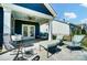 Inviting outdoor seating area with stylish furniture and a ceiling fan for comfortable enjoyment at 12512 Journeys End Trl, Huntersville, NC 28078
