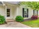 Close-up of the front porch, showing the entrance, lush landscaping, and covered entryway at 1252 Spring View Ct, Rock Hill, SC 29732