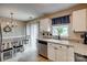 Cozy eat-in kitchen with white cabinets, stainless steel appliances, and lots of natural light at 1252 Spring View Ct, Rock Hill, SC 29732