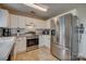 Modern kitchen with stainless steel appliances, white cabinetry, and a tile backsplash at 1252 Spring View Ct, Rock Hill, SC 29732