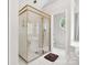 Bright bathroom showcasing glass enclosed shower with bronze trim and oval window at 1280 Willowbreeze Sw Ct, Concord, NC 28025