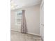 A bedroom with carpet, window, and white door with brass hardware at 1280 Willowbreeze Sw Ct, Concord, NC 28025