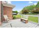 Relaxing front porch with seating, offering a peaceful view of the surrounding yard and neighborhood at 1280 Willowbreeze Sw Ct, Concord, NC 28025