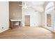 Bright living room featuring a brick fireplace, vaulted ceiling, and large window at 1280 Willowbreeze Sw Ct, Concord, NC 28025