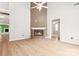 Spacious living room with a ceiling fan, fireplace, and hardwood flooring at 1280 Willowbreeze Sw Ct, Concord, NC 28025