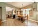 Cozy breakfast nook with a round table, adjacent to the kitchen, with large windows at 14926 Chilgrove Ln, Huntersville, NC 28078