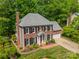 Beautiful brick two-story home featuring manicured lawn and an attached two-car garage at 14926 Chilgrove Ln, Huntersville, NC 28078