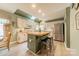 Bright kitchen features white cabinetry, stainless appliances, skylight and a butcher block island at 14926 Chilgrove Ln, Huntersville, NC 28078