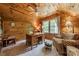 Office with wood paneled walls, built-in bookcase, and natural light creating a cozy, inviting space at 14926 Chilgrove Ln, Huntersville, NC 28078