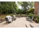 Spacious backyard with stone patio, comfortable seating, outdoor dining, and beautiful landscaping at 1943 S Wendover Rd, Charlotte, NC 28211