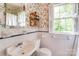 Whimsical bathroom featuring bird-themed wallpaper, a vintage-style sink, and bright natural light at 1943 S Wendover Rd, Charlotte, NC 28211