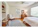 Bright bedroom featuring hardwood floors, neutral walls, ample natural light, and cozy decor at 1943 S Wendover Rd, Charlotte, NC 28211