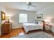 Bright bedroom featuring hardwood floors, neutral walls, and a window with bright natural light at 1943 S Wendover Rd, Charlotte, NC 28211