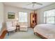 Inviting bedroom featuring a cozy seating area, plush chairs, and natural light through the windows at 1943 S Wendover Rd, Charlotte, NC 28211