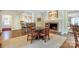 Cozy breakfast nook featuring a brick fireplace, hardwood floors, and comfortable seating at 1943 S Wendover Rd, Charlotte, NC 28211