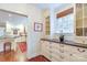 Butler's pantry with granite counters, shaker cabinets, and an open entry to the kitchen at 1943 S Wendover Rd, Charlotte, NC 28211