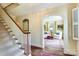 Hallway view with staircase and sitting room with a large area rug at 1943 S Wendover Rd, Charlotte, NC 28211