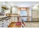 Bright kitchen featuring white cabinetry, granite countertops, and stainless steel appliances at 1943 S Wendover Rd, Charlotte, NC 28211