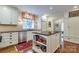 Bright kitchen featuring white cabinetry, granite countertops, and stainless steel appliances at 1943 S Wendover Rd, Charlotte, NC 28211