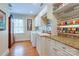 Functional laundry room with granite countertops, storage cabinets, wrapping paper station, and a window at 1943 S Wendover Rd, Charlotte, NC 28211
