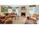 Cozy living room with a fireplace, large windows, and comfortable seating at 1943 S Wendover Rd, Charlotte, NC 28211
