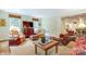 Bright living room boasting two patterned chairs, a leather armchair, and a wooden coffee table at 1943 S Wendover Rd, Charlotte, NC 28211