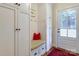 Functional mudroom with built-in storage, a bench, and a convenient entrance from the exterior at 1943 S Wendover Rd, Charlotte, NC 28211
