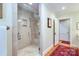 Contemporary shower with glass enclosure, built-in shelves, and neutral tile, showcasing a modern design at 1943 S Wendover Rd, Charlotte, NC 28211