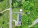 Overhead view of a house, detached garage, and carport surrounded by lush greenery at 1981 Line Rd, Lancaster, SC 29720