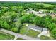 Aerial shot of a white home featuring a two-car garage, a carport, and a lush green yard at 1981 Line Rd, Lancaster, SC 29720