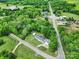 Aerial view of home with lush green surroundings featuring a detached garage and carport at 1981 Line Rd, Lancaster, SC 29720