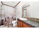 Clean bathroom featuring wood cabinets, a modern vanity, and a shower with an artistic curtain at 1981 Line Rd, Lancaster, SC 29720