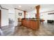 Open concept kitchen with laminate floors, an island with pendant lights and an opening looking into dining area at 1981 Line Rd, Lancaster, SC 29720