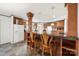Open kitchen design featuring an island bar with seating, laminate floors, and well-lit space at 1981 Line Rd, Lancaster, SC 29720