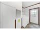 A well-lit laundry room featuring modern appliances and a convenient exterior access door at 1981 Line Rd, Lancaster, SC 29720