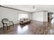 Inviting living room boasts wood flooring, a large window, and neutral wall paint at 1981 Line Rd, Lancaster, SC 29720