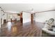 Wide open living space featuring wood flooring, access to dining room, and neutral paint at 1981 Line Rd, Lancaster, SC 29720