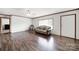 Bright living room featuring wood flooring, a large window, and a ceiling fan at 1981 Line Rd, Lancaster, SC 29720