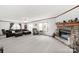 Large living room featuring a stone fireplace, natural light, and plush carpeting at 1981 Line Rd, Lancaster, SC 29720